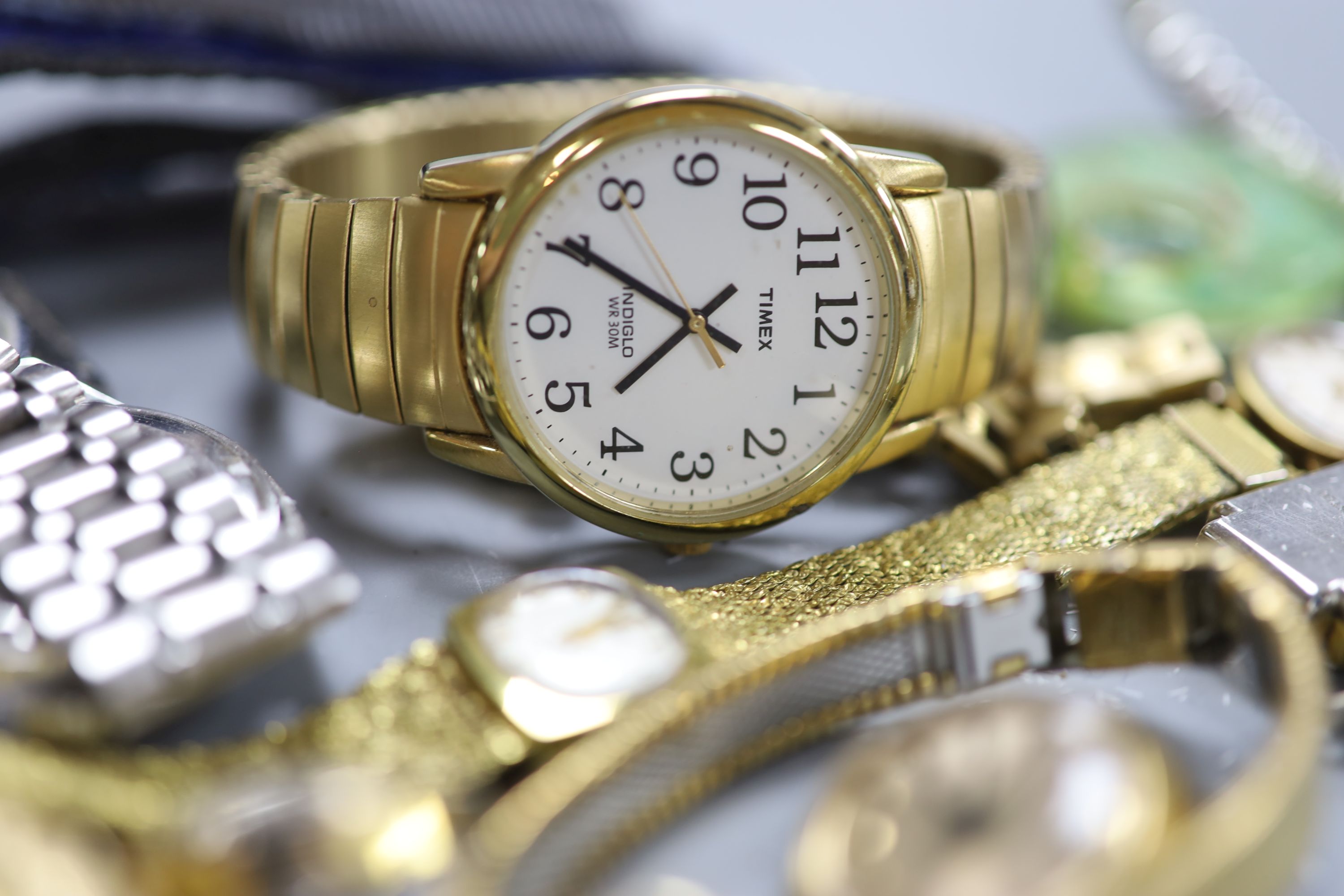 A collection of assorted lady's and gentleman's wristwatches including Timex, Accurist and Seiko.